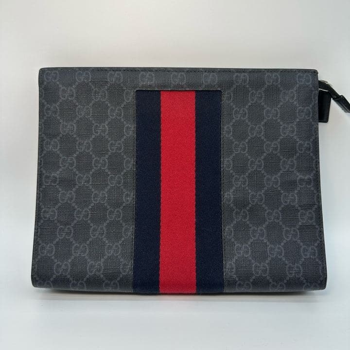 Gucci GG Supreme Clutch, Black, condition grade A